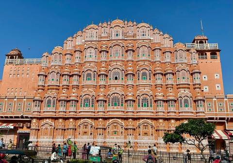       Elaborate facade of a historic building with many windows.
  