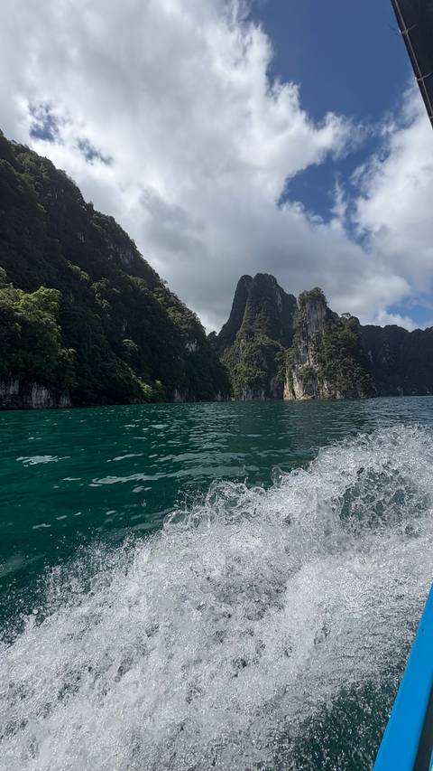 River view with lush greenery on both sides.