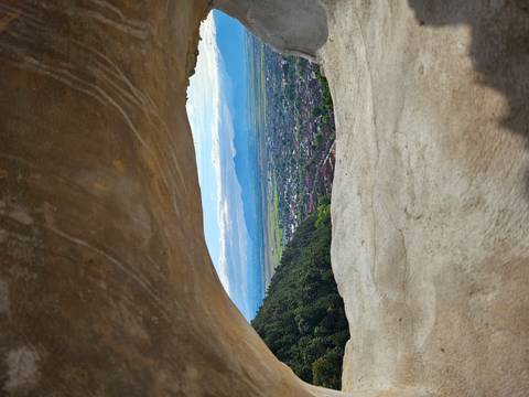View over a town through a stone arch