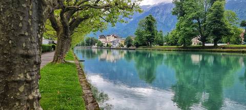 A serene river with a mountain view.