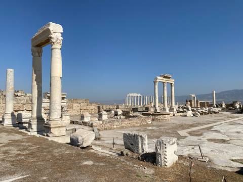 Panoramic view of ancient ruins with stone columns.