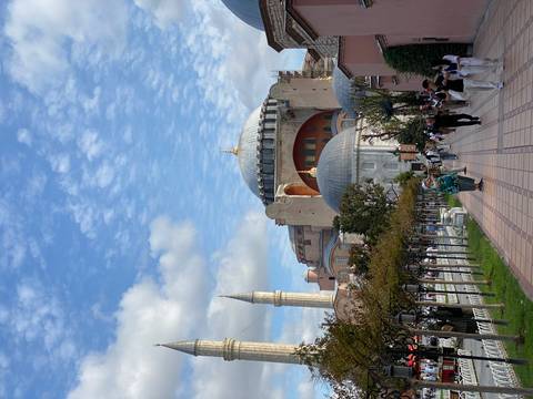       Hagia Sophia with people walking in the foreground.
  