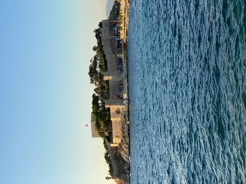 Coastal fortress with a flag on a sunny day.