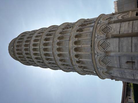 Famous leaning tower with clear blue sky backdrop.