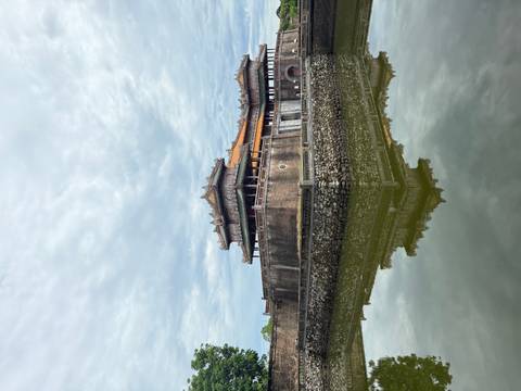      Historical building with water reflection.
  