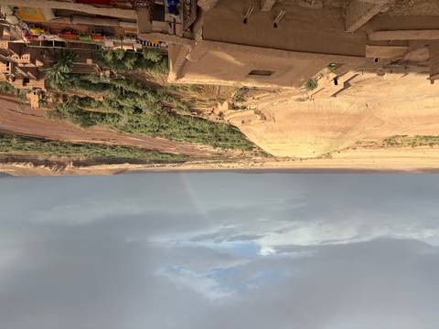       Desert view with a rainbow in the background.
  