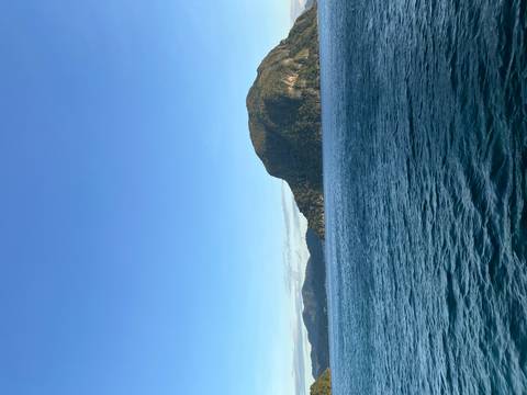 Sea view with mountains in the background.