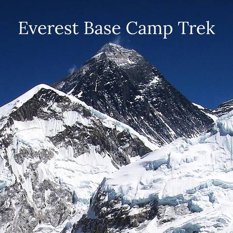 Snow-covered mountain peak with clear blue sky.