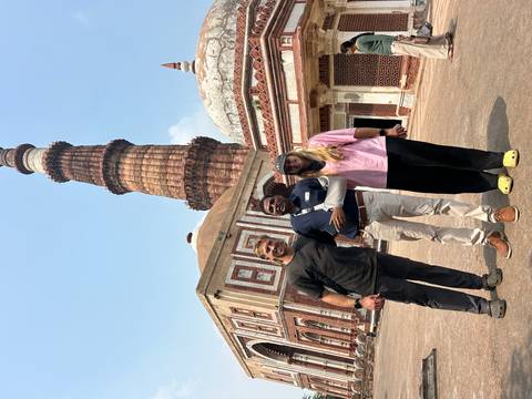       Group photo in front of the Qutub Minar.
  