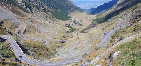       Winding mountain road with multiple switchbacks.
  