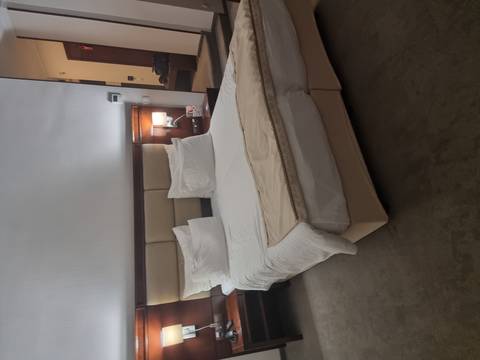       Interior of a modern hotel room with double bed.
  