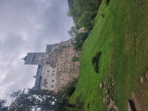       Steep hill with a historical fortress at the top.
  