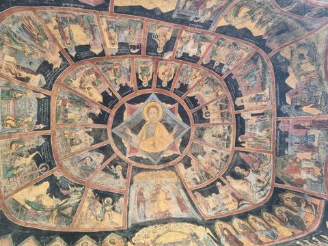       Intricate religious painting on a circular ceiling.
  