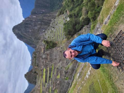A person with Machu Picchu in the background.