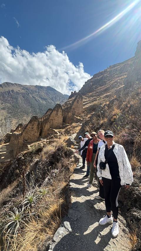 Group hiking ruins above Ollantaytambo.