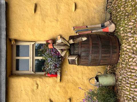 Colorful buildings with tourists on a street.