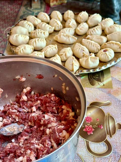 Preparation of traditional dumplings with minced meat.