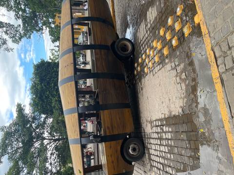       Vehicle designed to resemble a wooden barrel on a street.
  