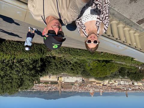 Couple with a scenic view of Florence in the background.