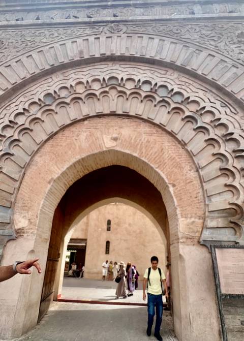       Stone arch with intricate patterns, likely part of a historic structure.
  