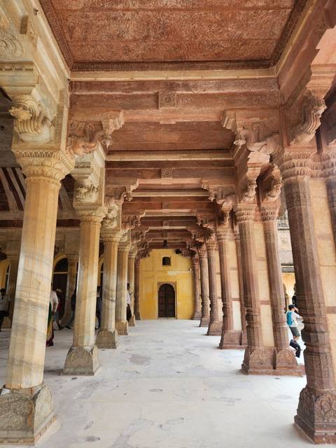 Intricately carved stone pillars in historical architecture.