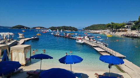 Beach with umbrellas and people enjoying the sun