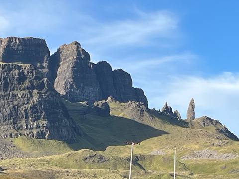 Rocky peaks of the Storr Mountains under a clear blue sky.