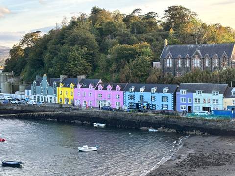 Colorful row houses along a waterfront.