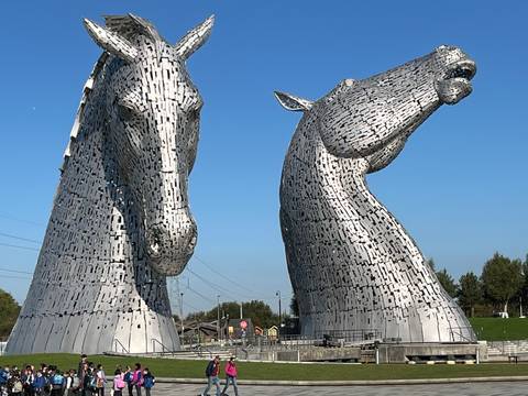       Sculptures of two large horse heads known as the Kelpies.
  