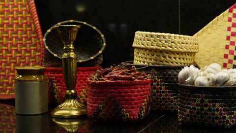       Various traditional craft items including baskets and a candle holder.
  