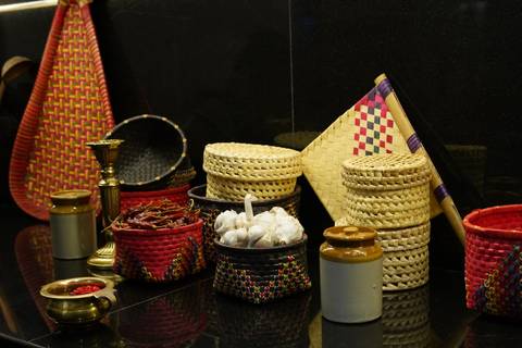       Display of traditional baskets, spices, and jars.
  