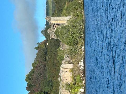 Historic ruins by a lake in Scotland.