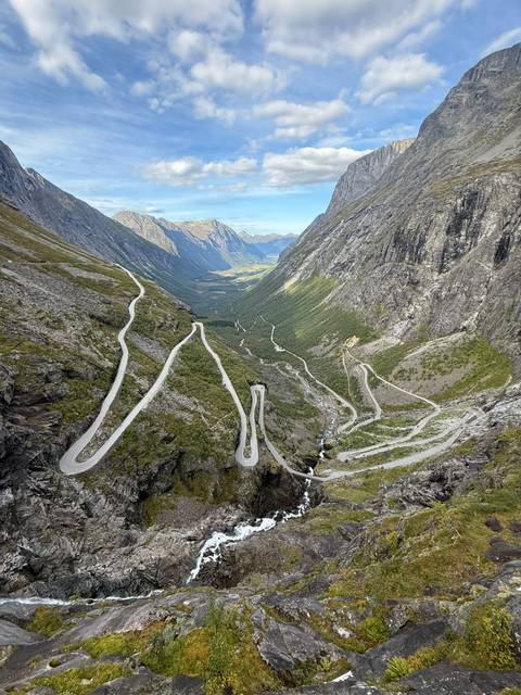 A winding road through steep mountainous terrain.