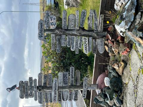 Multilingual welcome signs arranged creatively.