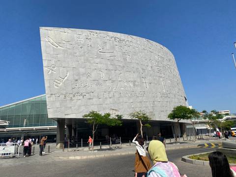       Modern library with hieroglyphics and relief carvings on the facade.
  