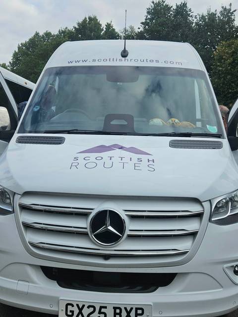      Van with 'Scottish Routes' branding on the hood.
  
