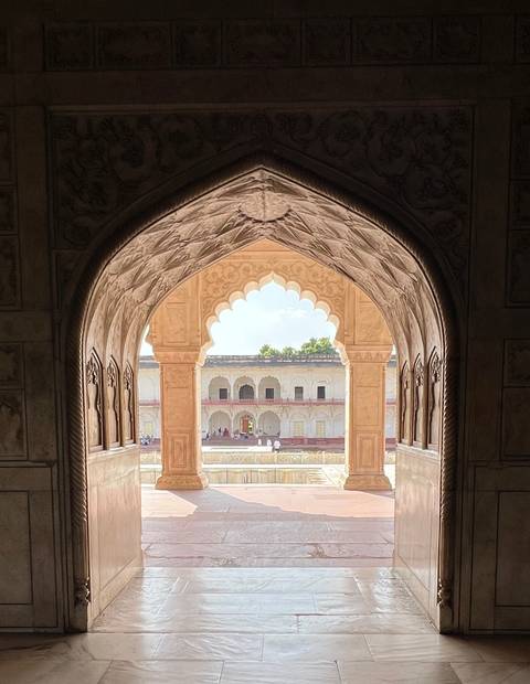 Panoramic view of an ancient fort through an archway