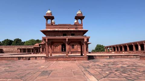 Historical red sandstone architecture under blue sky