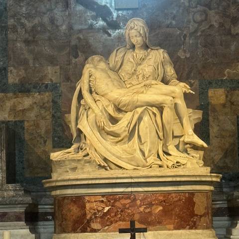       A famous sculpture of a person being held in another's arms, carved from marble.
  