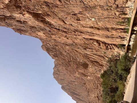       A vast rocky cliff dominating the landscape.
  
