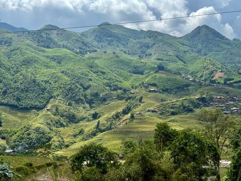 Vast terraced landscape under a cloudy sky.