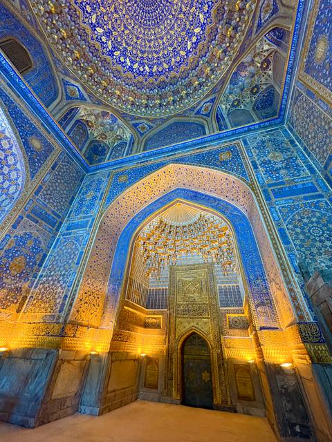Intricate mosaic and tilework inside a historical building.