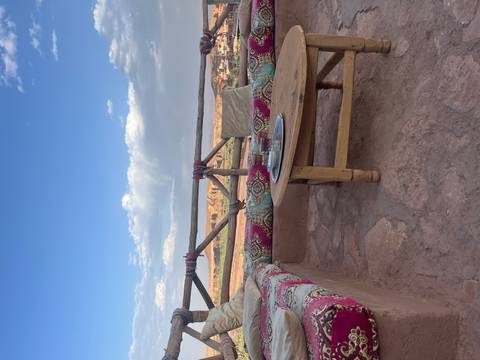       A cozy seating area with a view of the landscape.
  