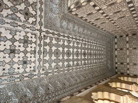 Intricate decorative ceiling and walls in a historic room.