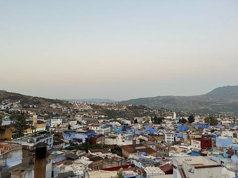 Panoramic view of a town with blue and white buildings.