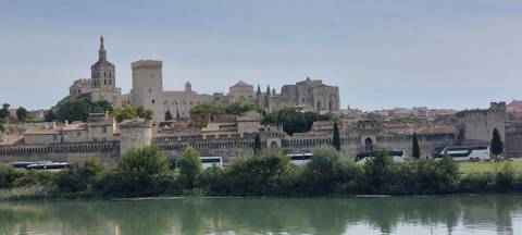 Historic cityscape with palatial buildings and a river.