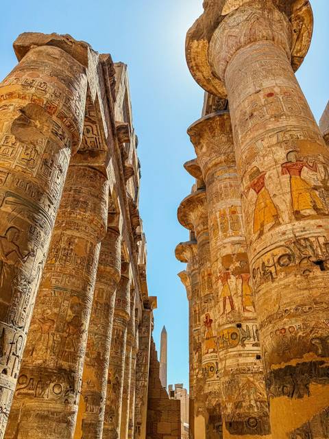 Detailed view of ancient stone columns with engraved hieroglyphs.