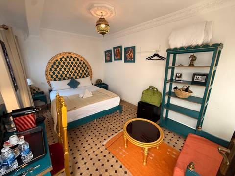       Beautifully decorated hotel room with traditional decor.
  