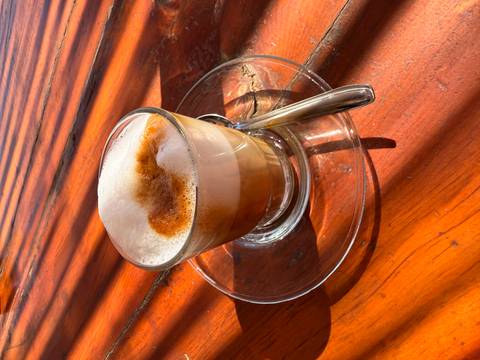       Well-decorated hotel room interior with a bed and furniture.
  