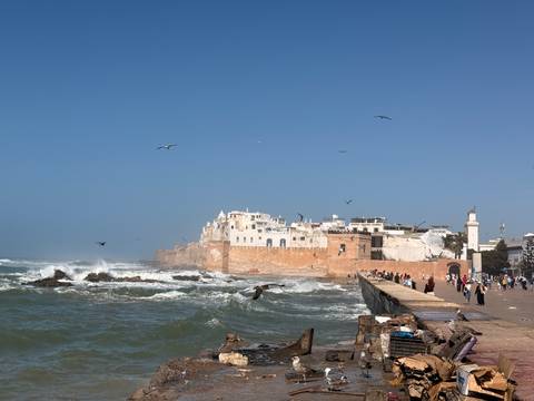       Night camp setting with traditional tents and lanterns in the desert.
  